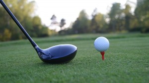 Golf teeing off