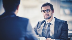 Young businessman communicating with colleague