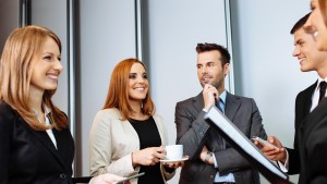 Business people talking during conference break