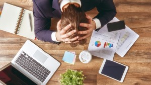 Businessman with hands in head