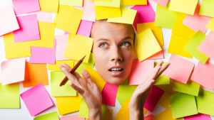 Businesswoman with lots of reminder notes