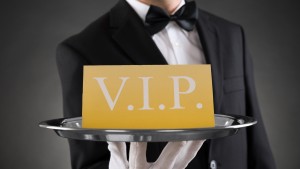 Waiter presenting VIP sign on silver platter