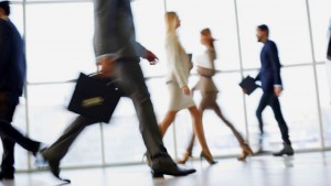 Business people walking along corridor