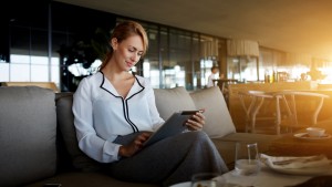 Elegant businesswoman using tablet