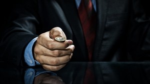 Businessman flipping coin