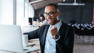 Young businessman celebrating success